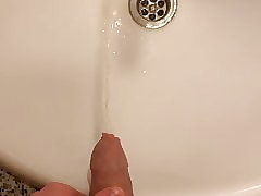 Pissing together with wanking